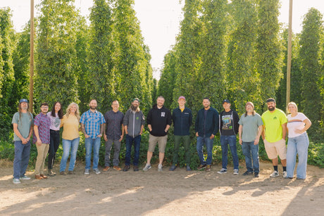 Yakima Valley Hops team in a hop field